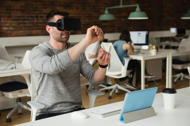 Male executive using virtual reality headset