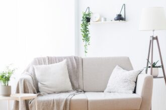 Modern light couch at living room interior, empty space